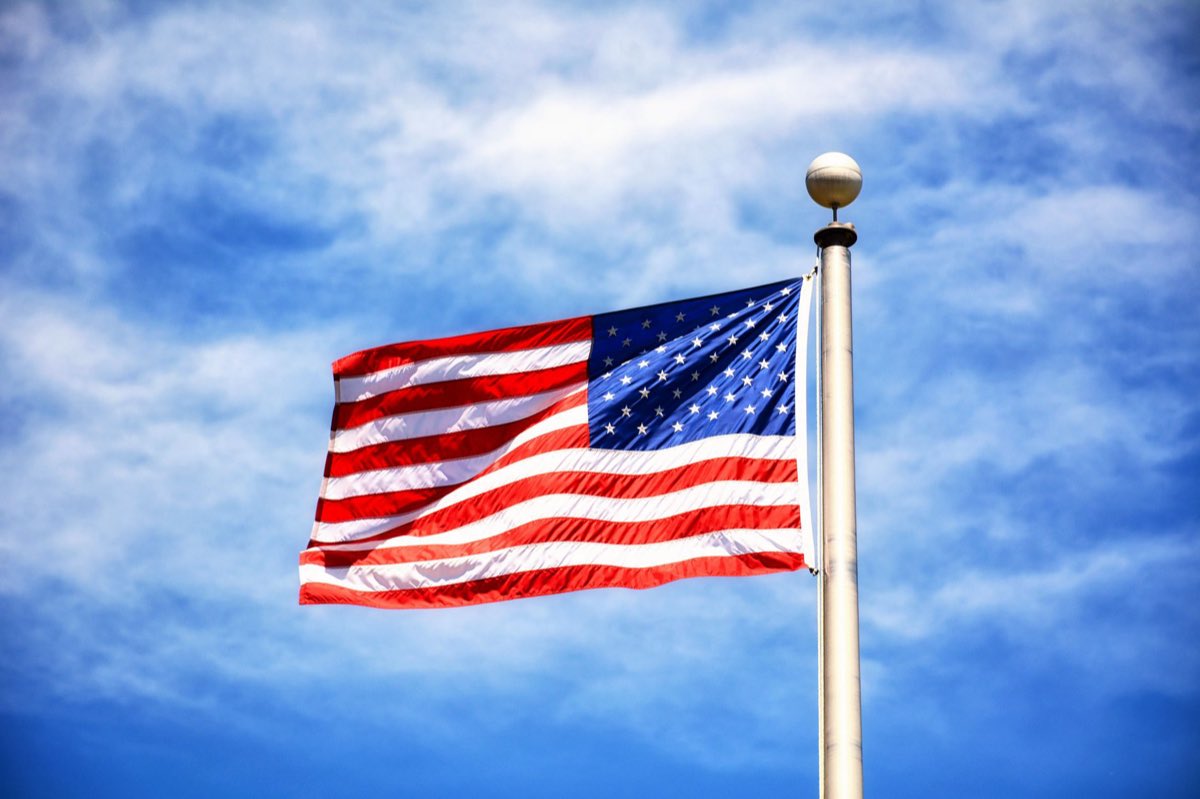 Study materials and a U.S. flag representing the citizenship civics test
